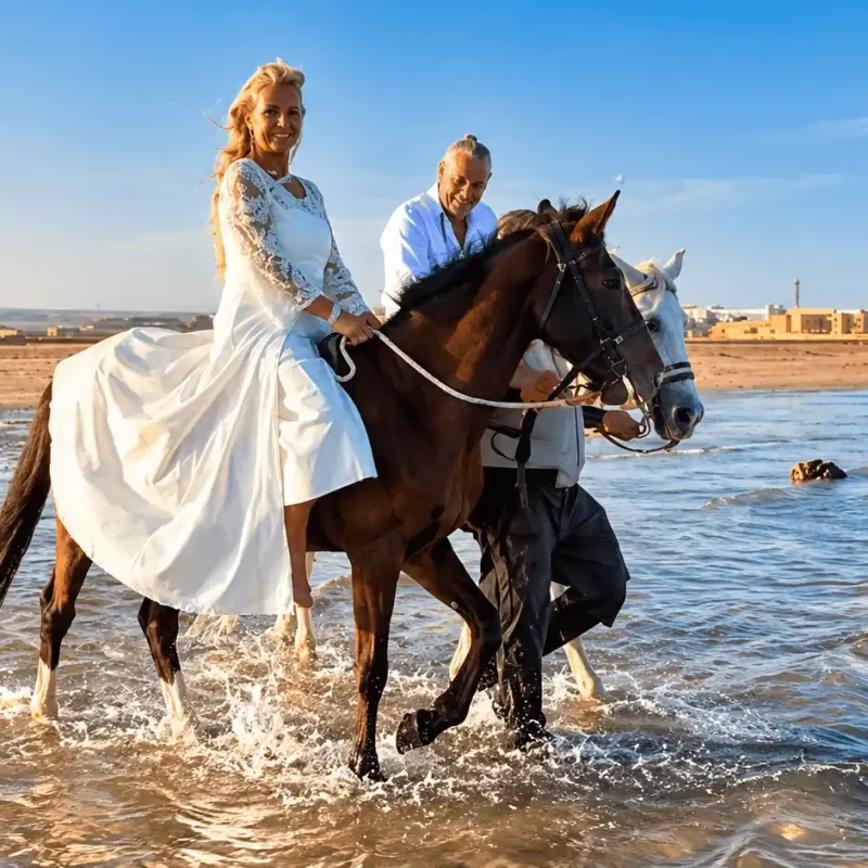 Wedding Couple Horseback Riding Through Surf